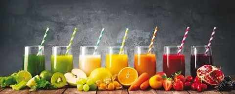 A lush, green leaf with water droplets, symbolizing sustainability